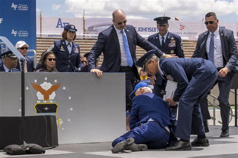 Biden falls on stage during Air Force graduation ceremony
